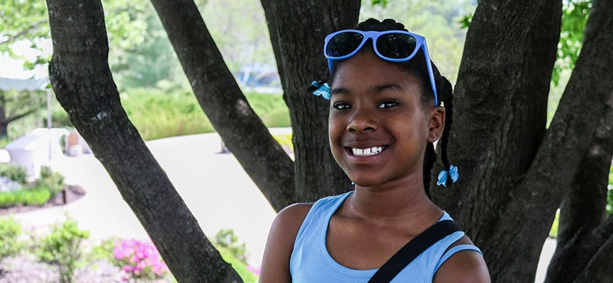 Tatyana, pediatric grant recipient, smiles after receiving surgery to restore her dental health.