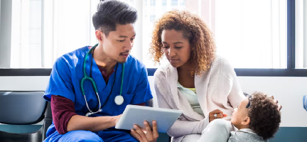 clinician talking to mother with her son