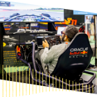 A person driving the Oracle Red Bull Racing simulator in the CLoudWorld Hub