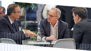 Three people networking at CloudWorld