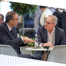 Three people networking at CloudWorld