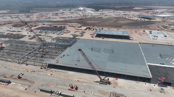 Aerial view of large building under construction